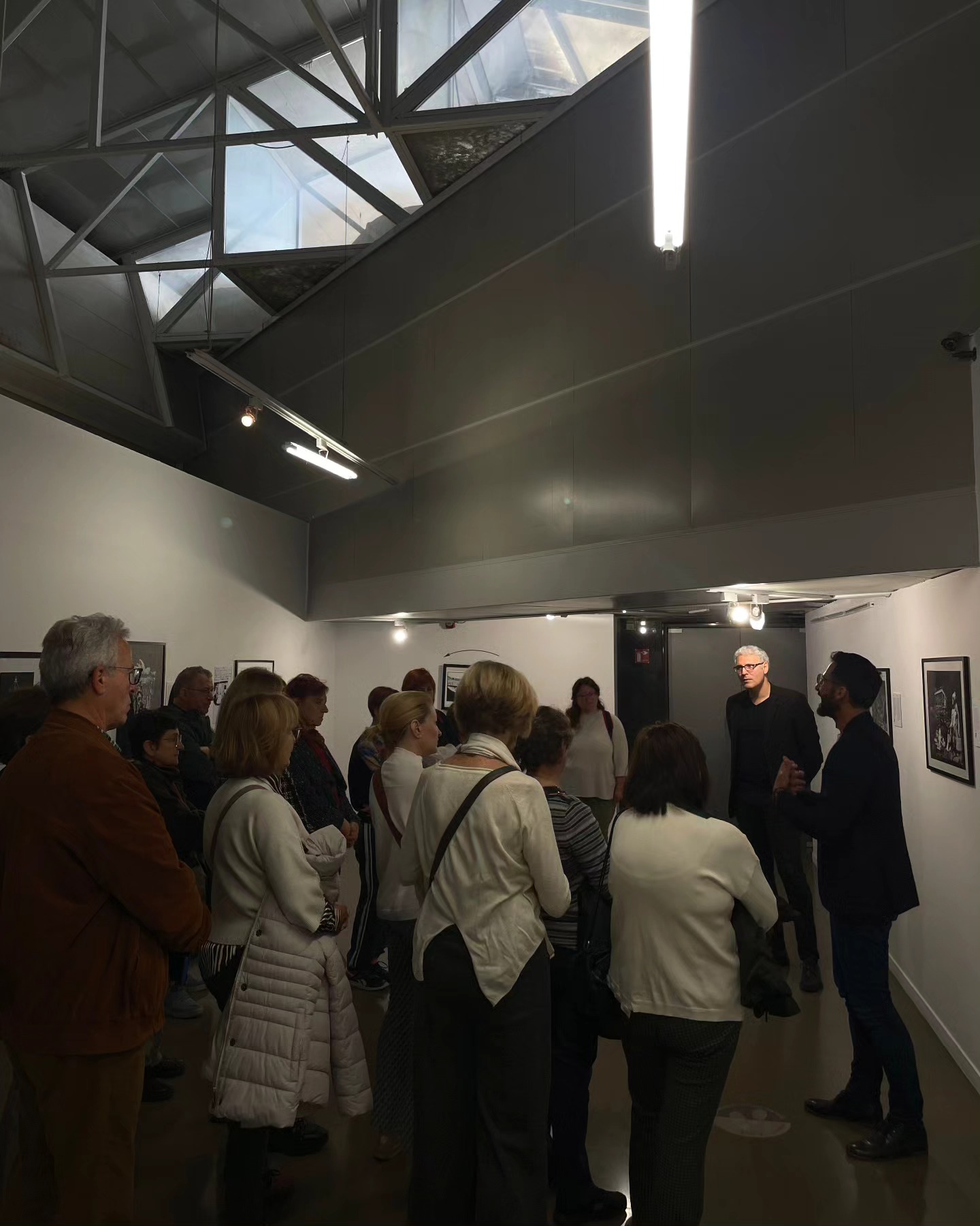 Alexandre Mitchell and Anastasios Karababas speaking with visitors at Teloglion