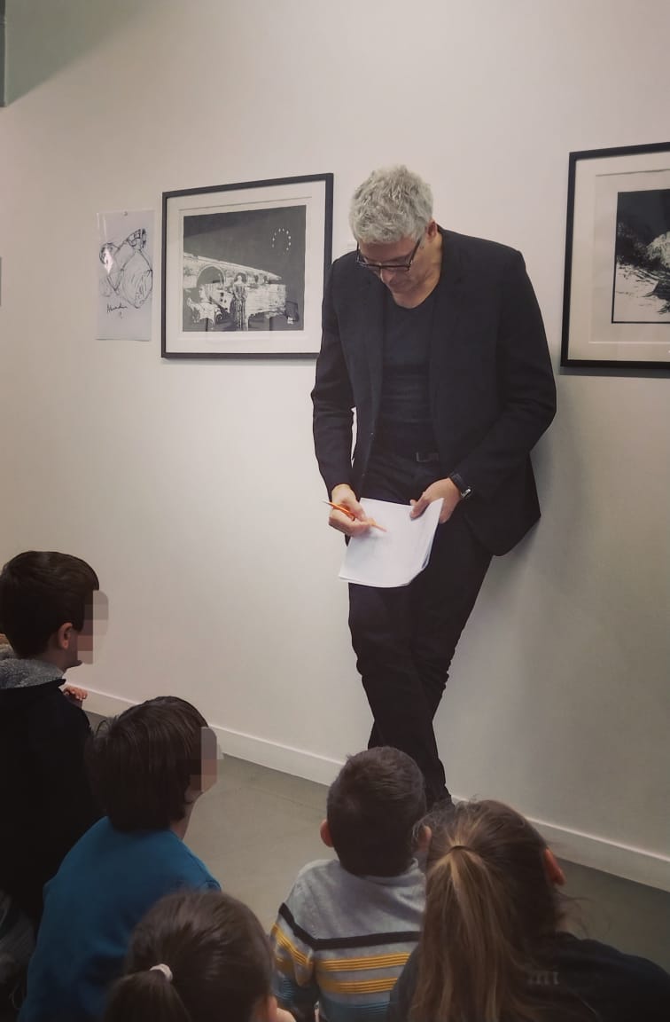 Alexandre Mitchell speaking with a school group at Teloglion