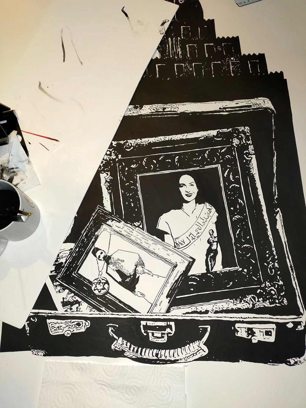 West of Eden 2026 work in progress, historical portraits being drawn inside the suitcase